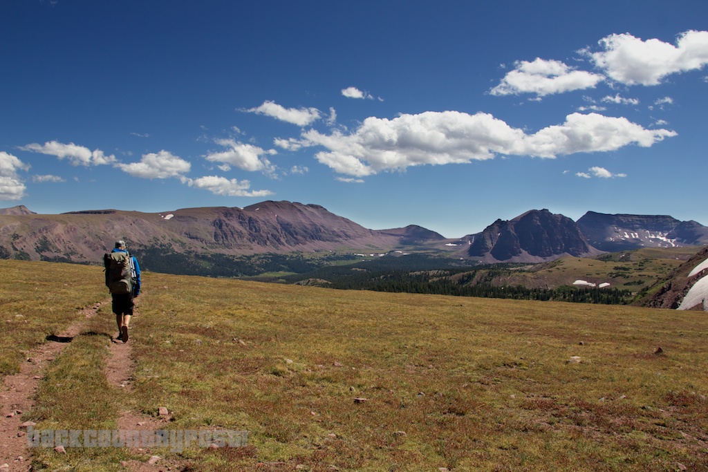 hiker approaching red castle