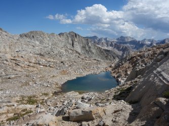 Descending Potluck Pass with Black Divide in the distance